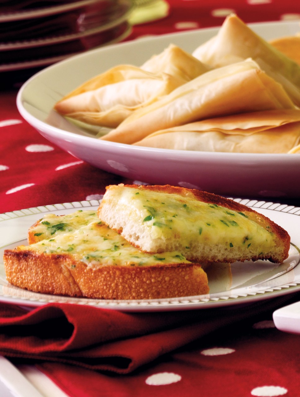 Raclette Toasts with Roasted Garlic and Black Pepper