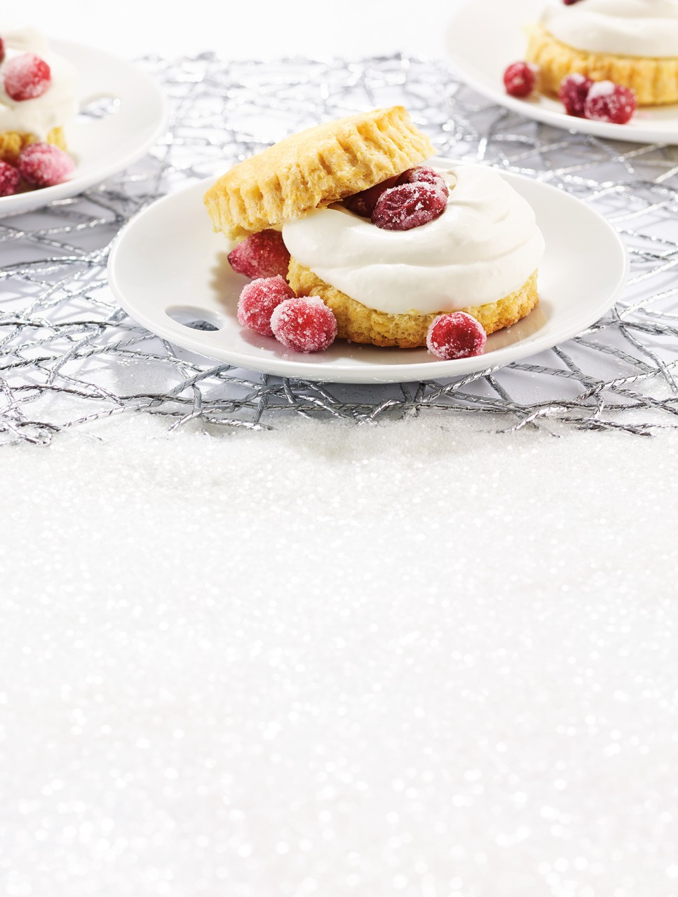 Cornmeal Shortcakes topped with Fresh Cream & Candied Cranberries