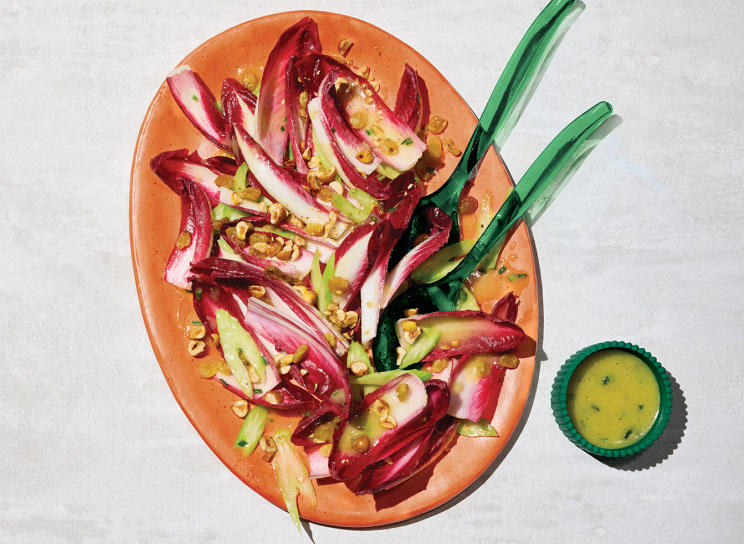 A plate of red endive salad with pickled raisins